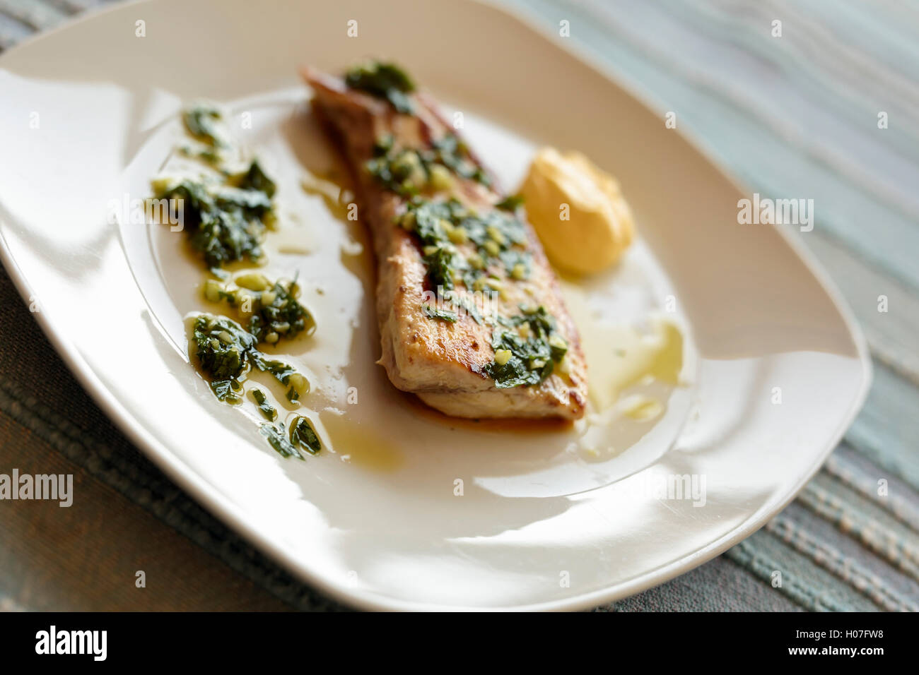 Grilled swordfish with garlic sauce and perjil Stock Photo Alamy