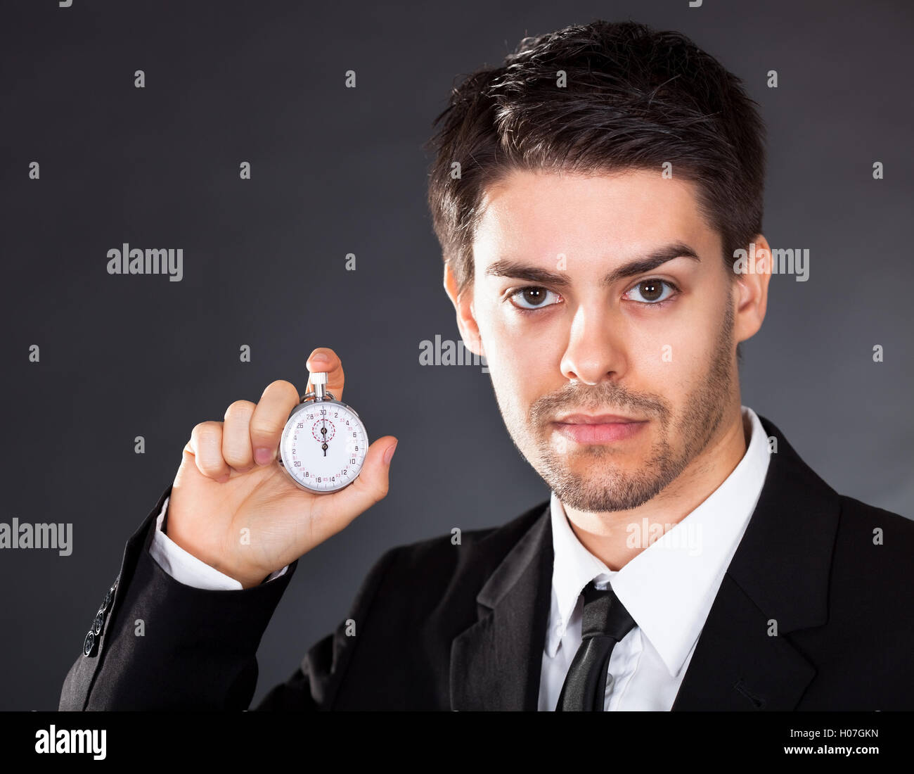 Stop Watch Rude Business man with stop watch Stock Photo - Alamy