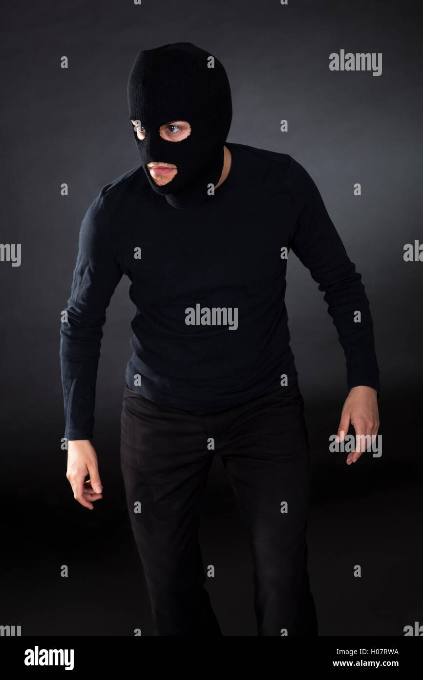 Thief wearing a balaclava Stock Photo Alamy