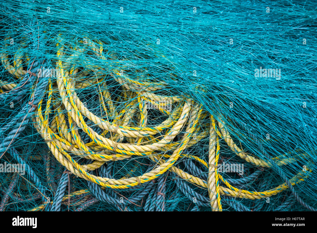Piles of colorful fishing rope and net at Trout River, Newfoundland and Labrador, Canada. Stock Photo