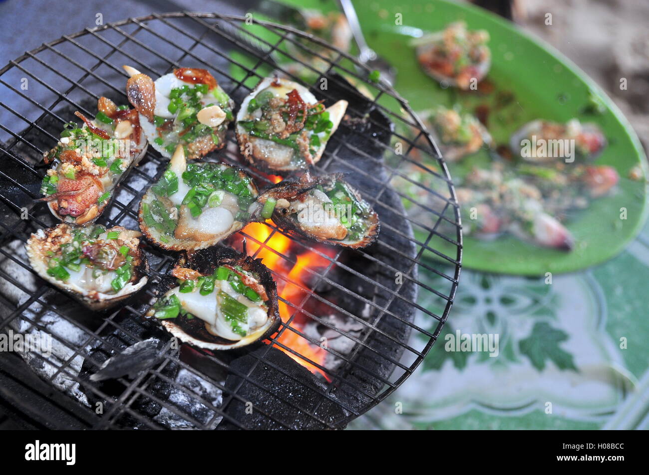 Grilling shellfish and seafood on hot fire Stock Photo