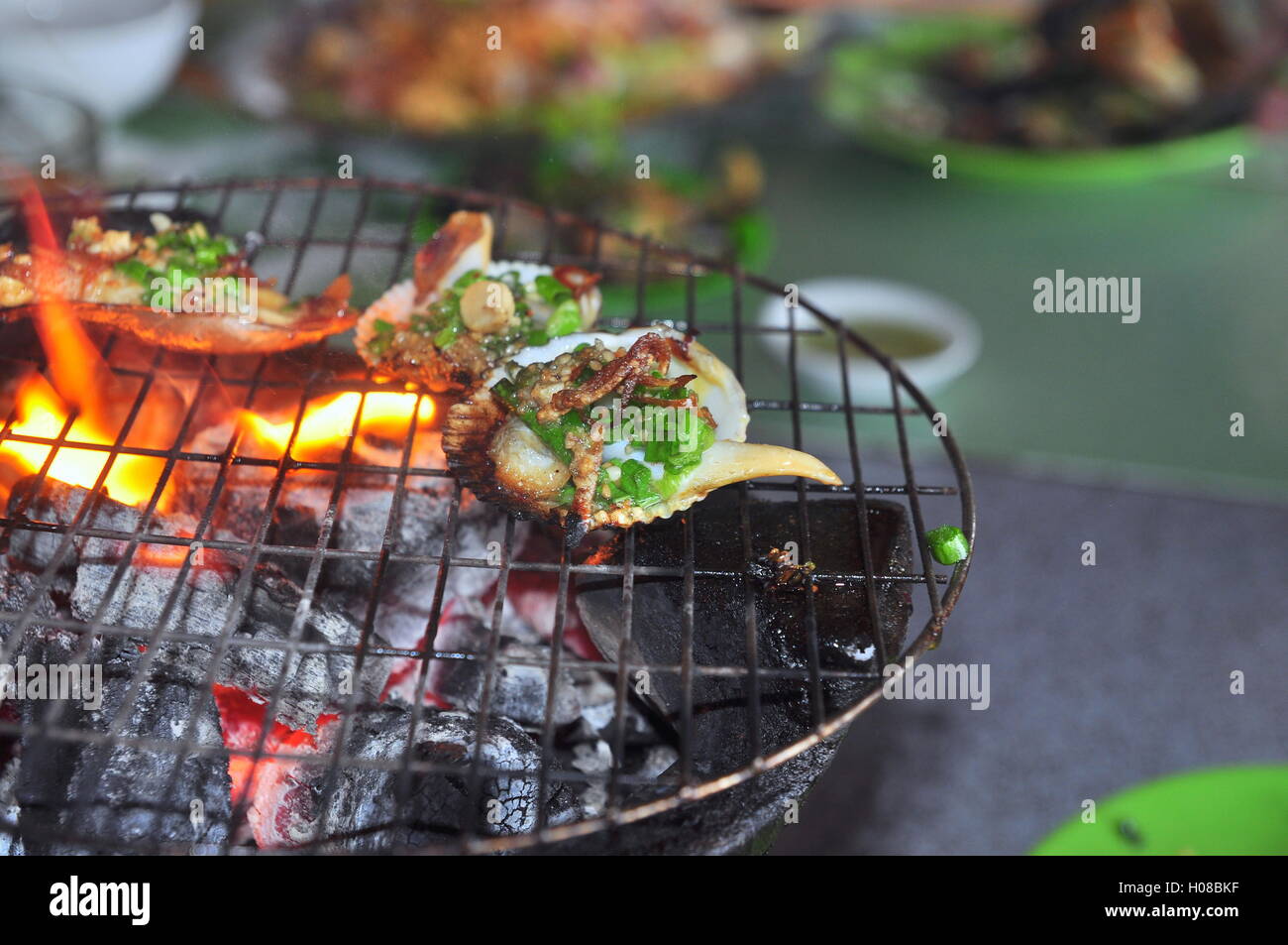 Grilling shellfish and seafood on hot fire Stock Photo