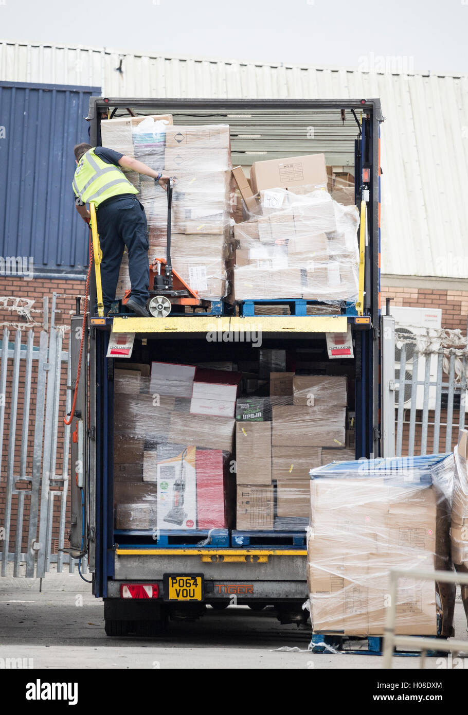 Driver unloading B&M truck at B&M store. England. UK Stock Photo