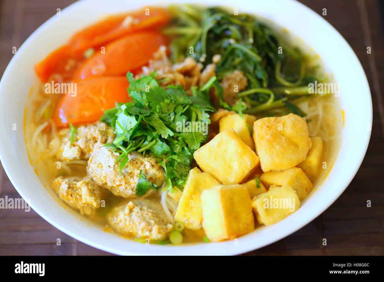 Bun Rieu or Vietnamese vermicelli noodle soup with milled crab meat