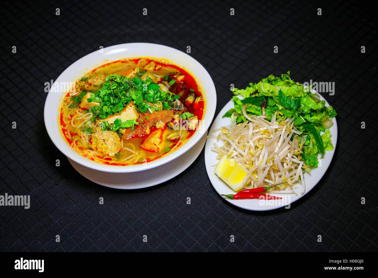 Bun Rieu or Vietnamese vermicelli noodle soup with milled crab meat