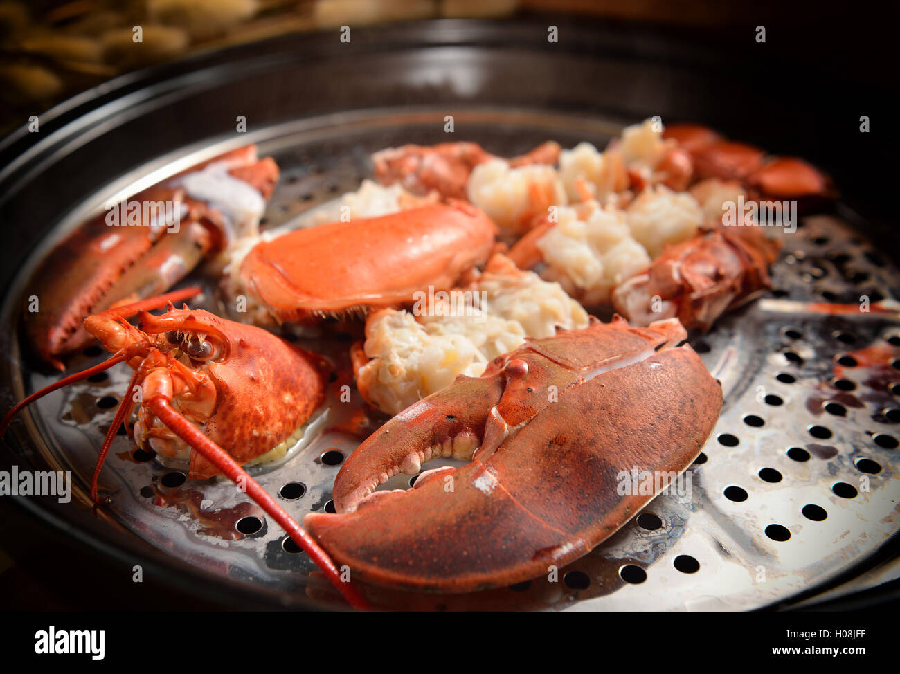 Steamed lobster with big claws on pan Stock Photo Alamy