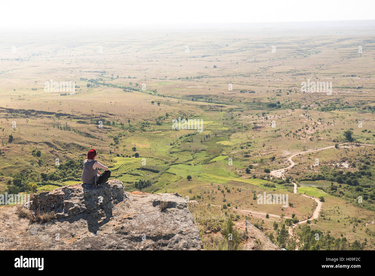 Tourist in Isalo National Park looking over Ihorombe Plains, Southwest Madagascar, Africa Stock Photo