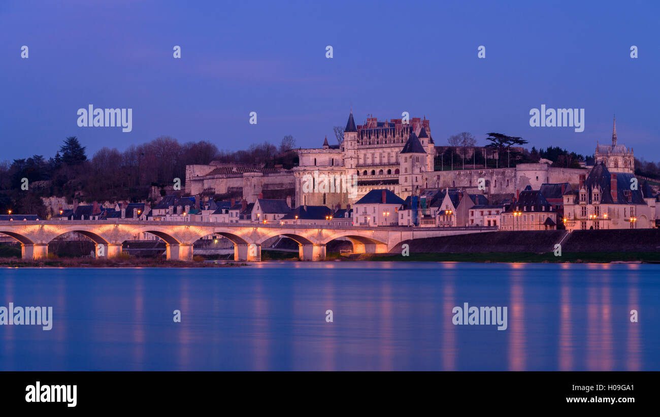 Royal chateau of Amboise lit at dusk on the banks of River Loire, Loire ...