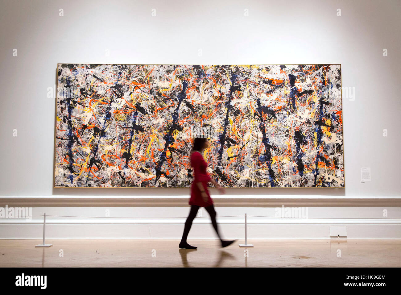 A woman walks past 'Blue Poles', 1952 by Jackson Pollock during a photocall  at the Royal Academy of Arts, London Stock Photo - Alamy