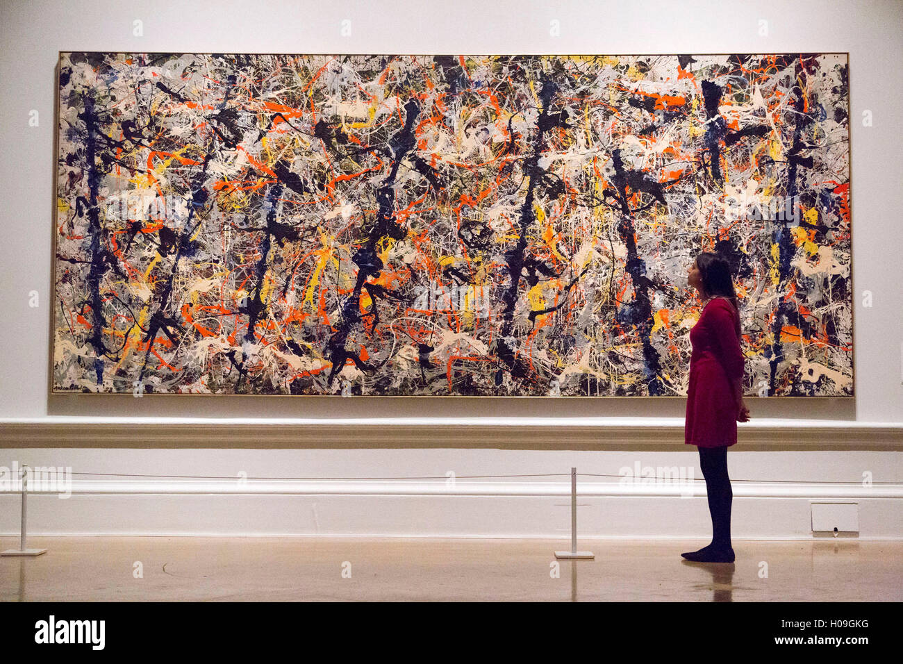 A woman looks at 'Blue Poles', 1952 by Jackson Pollock during a photocall  at the Royal Academy of Arts, London Stock Photo - Alamy