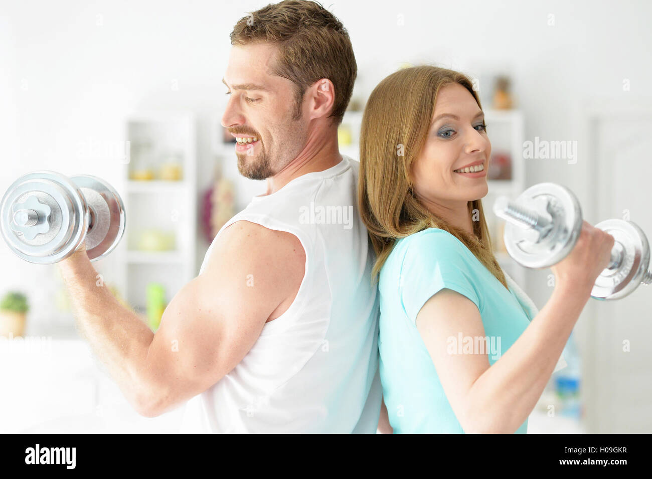 Attractive couple at the gym Stock Photo - Alamy