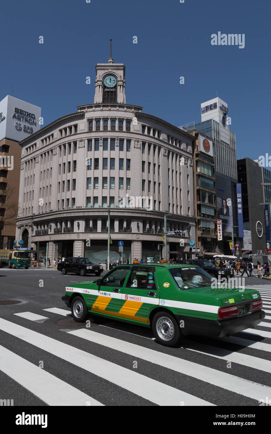 Taxi passing Wako department store in the Ginza district of Tokyo, Japan, Asia Stock Photo