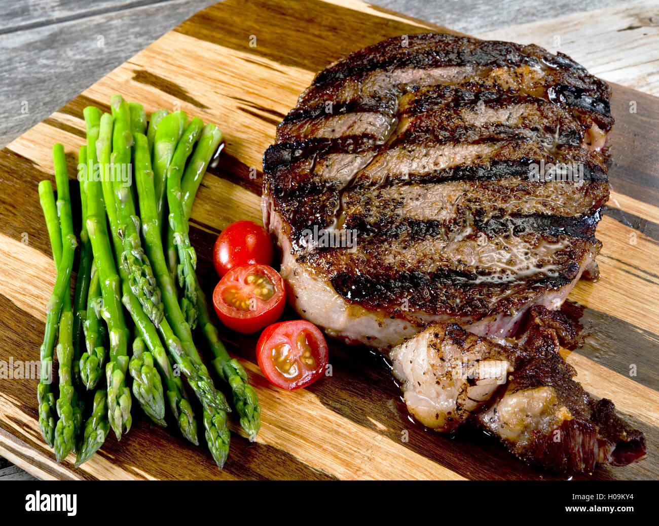 Fresh grilled thick rib eye steak ready to eat Stock Photo Alamy