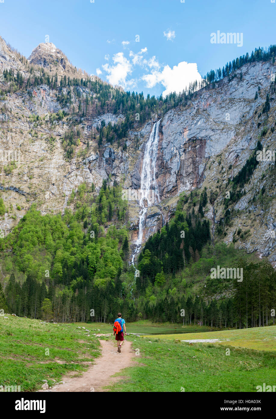 Hiker on way to Röthbach Waterfall, highest waterfall in Germany, Salet am Königssee, National Park Berchtesgaden Stock Photo