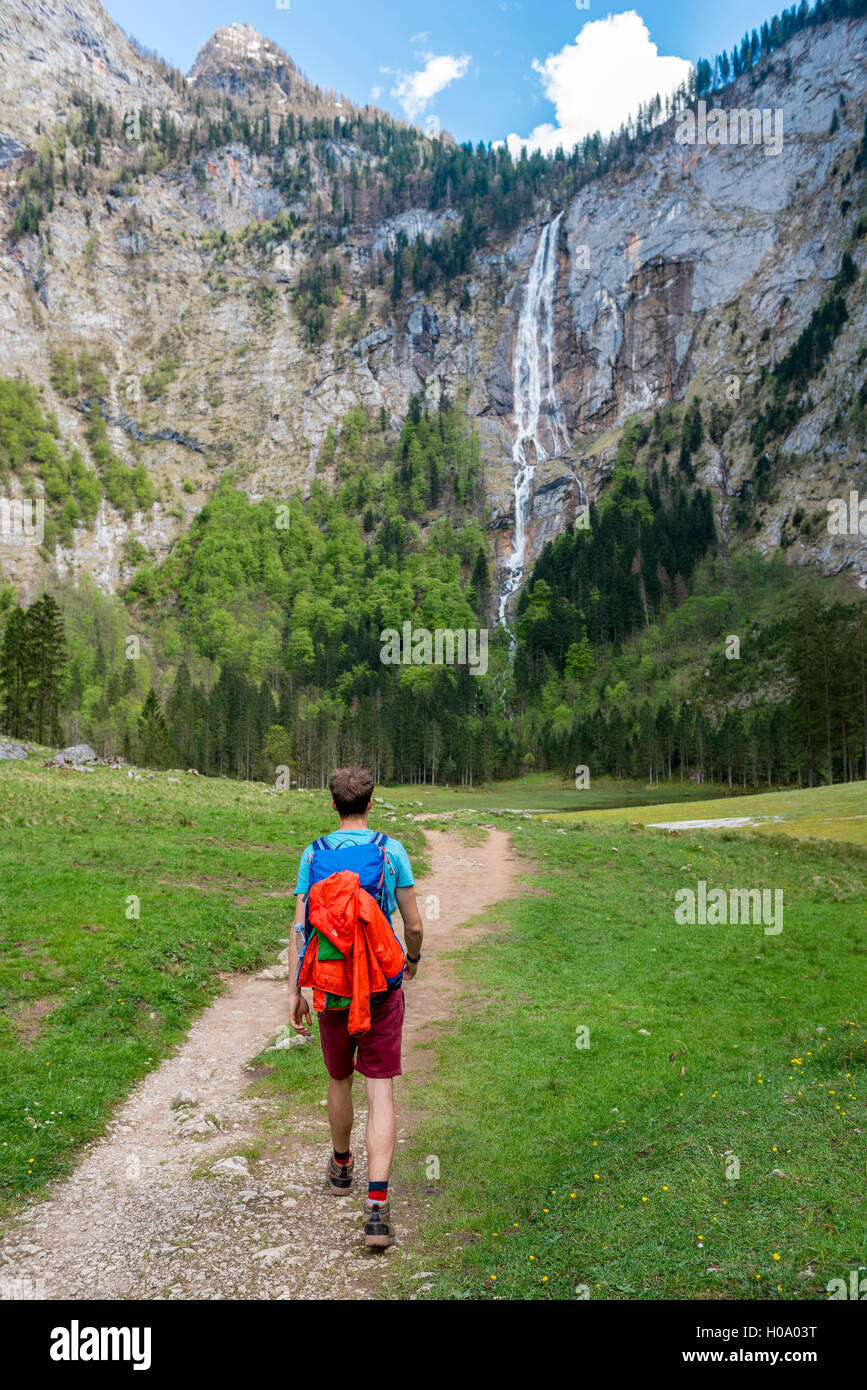 Hiker on way to Röthbach Waterfall, highest waterfall in Germany, Salet am Königssee, National Park Berchtesgaden Stock Photo