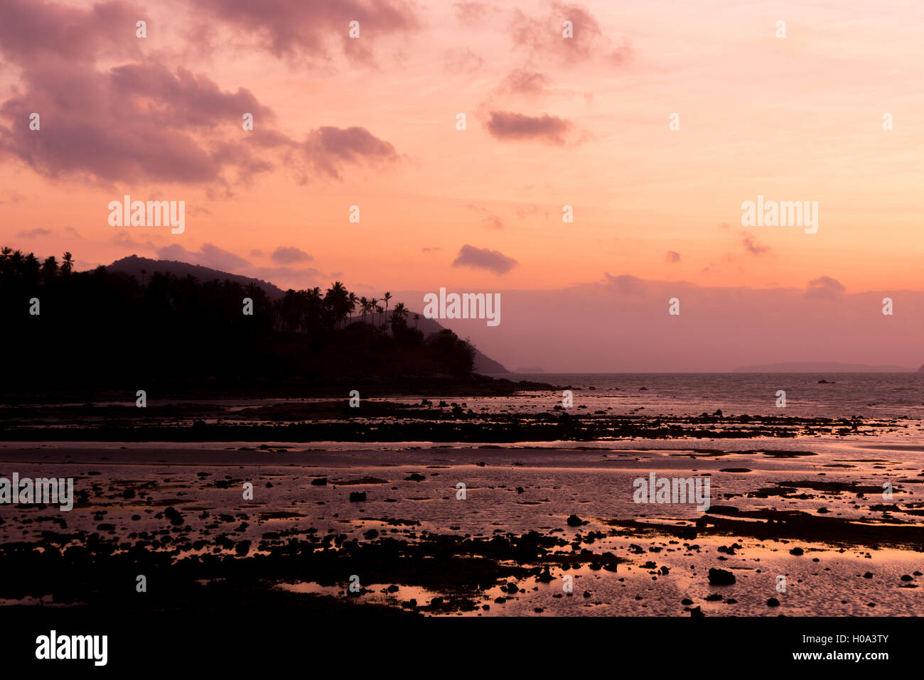 Tropical sunset on the beach in Thailand Stock Photo - Alamy