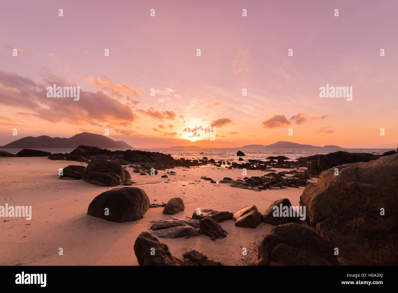 Tropical sunset on the beach in Thailand Stock Photo - Alamy