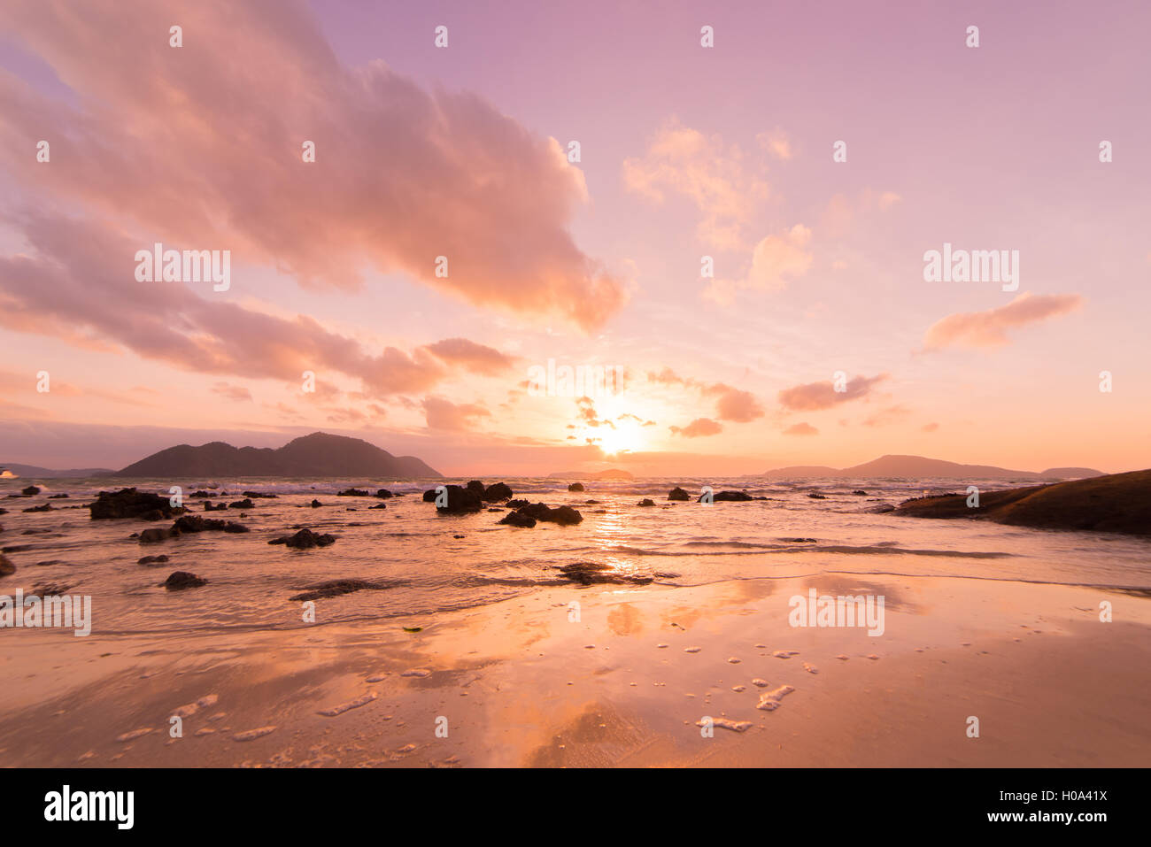 Tropical sunset on the beach in Thailand Stock Photo - Alamy