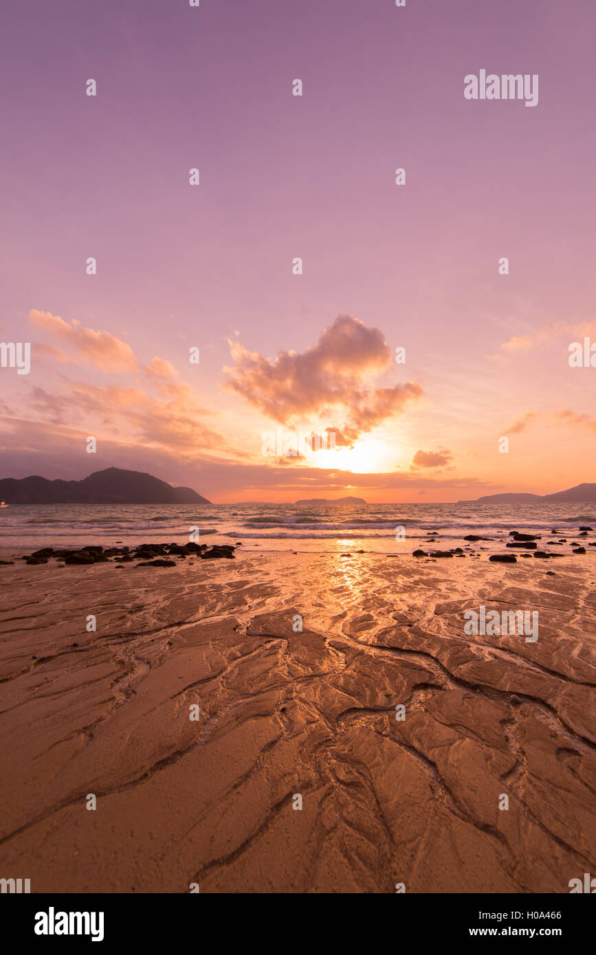 Tropical sunset on the beach in Thailand Stock Photo - Alamy