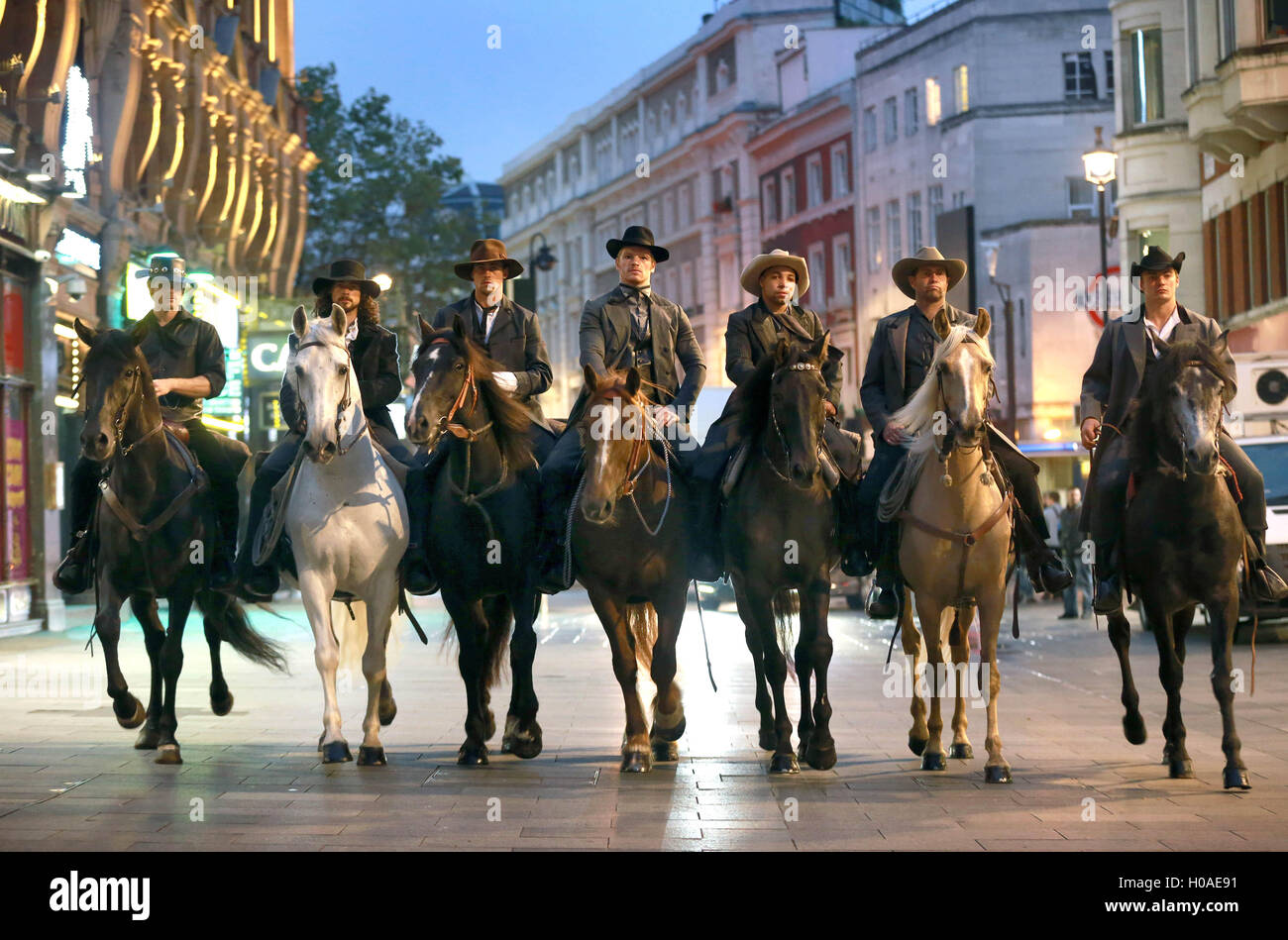 Seven horse riders, dressed as cowboys, arrive in London's Leicester Square ahead of a screening of the new film The Magnificent Seven, which stars Denzel Washington, Chris Pratt and Ethan Hawke and is released in cinemas in the UK and Ireland this Friday 23rdÃŠSeptember. Stock Photo
