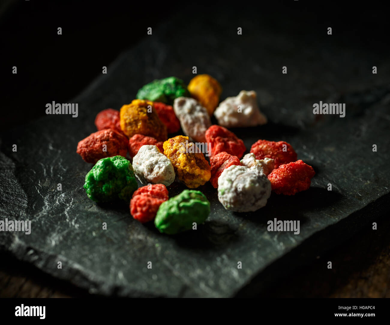Delicious hazelnut sweets on dark slate Stock Photo