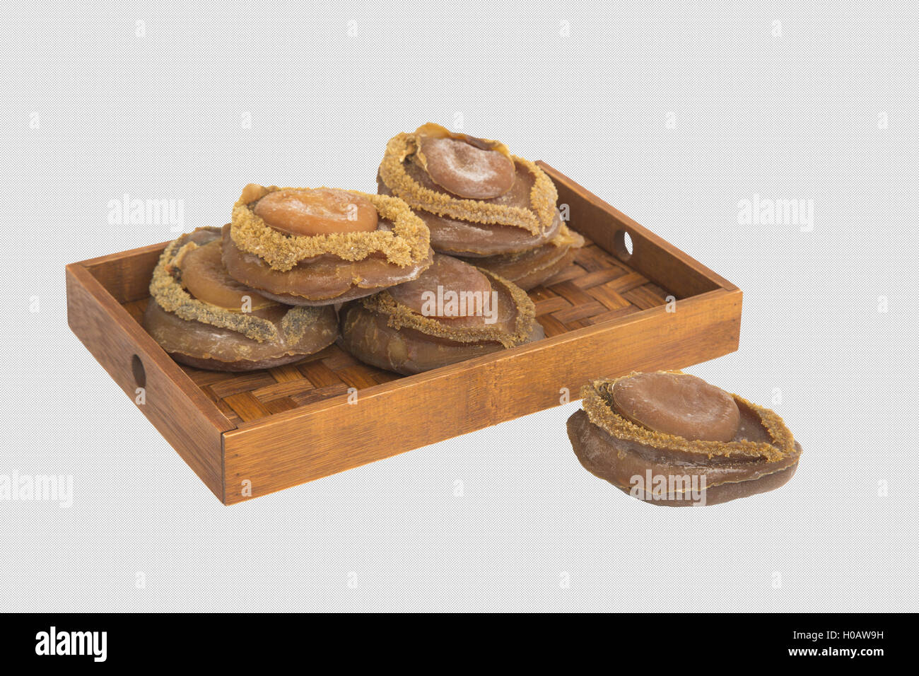 Dried abalone on bamboo tray in white background Stock Photo Alamy