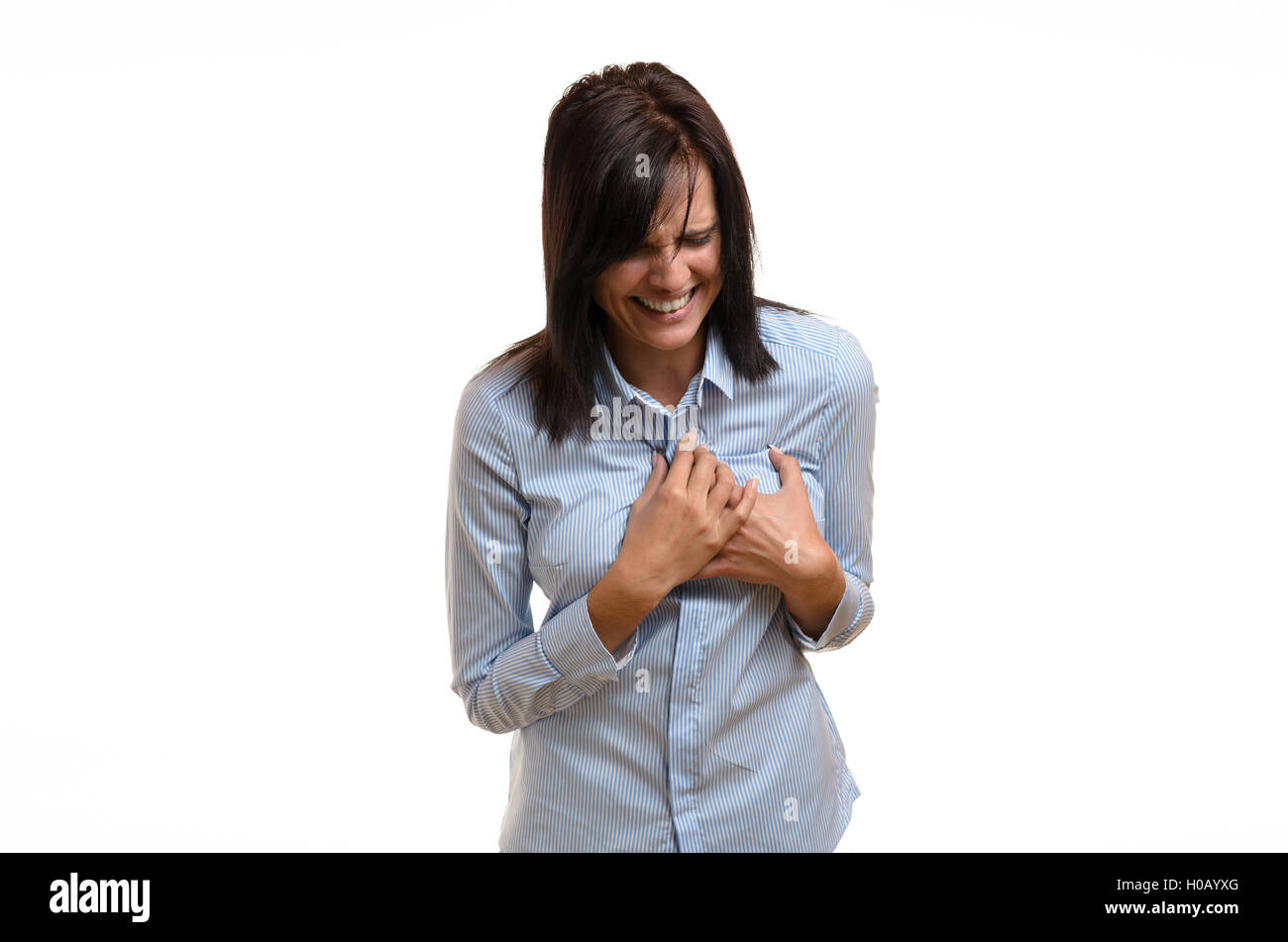 Young woman suffering angina, a myocardial infarct or a heart attack