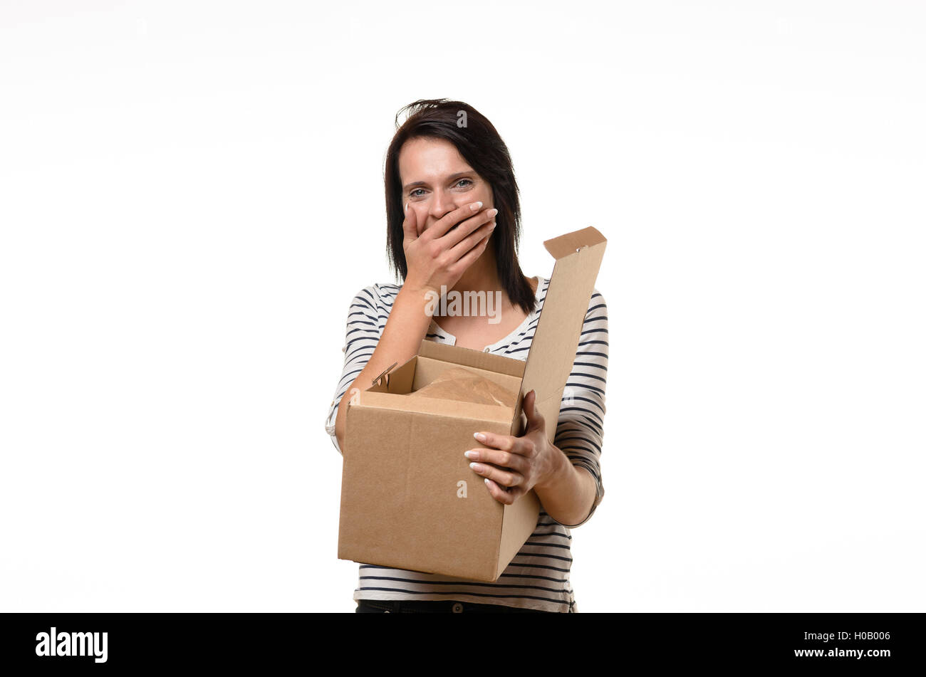 Front view of single surprised woman in striped shirt and brown hair ...