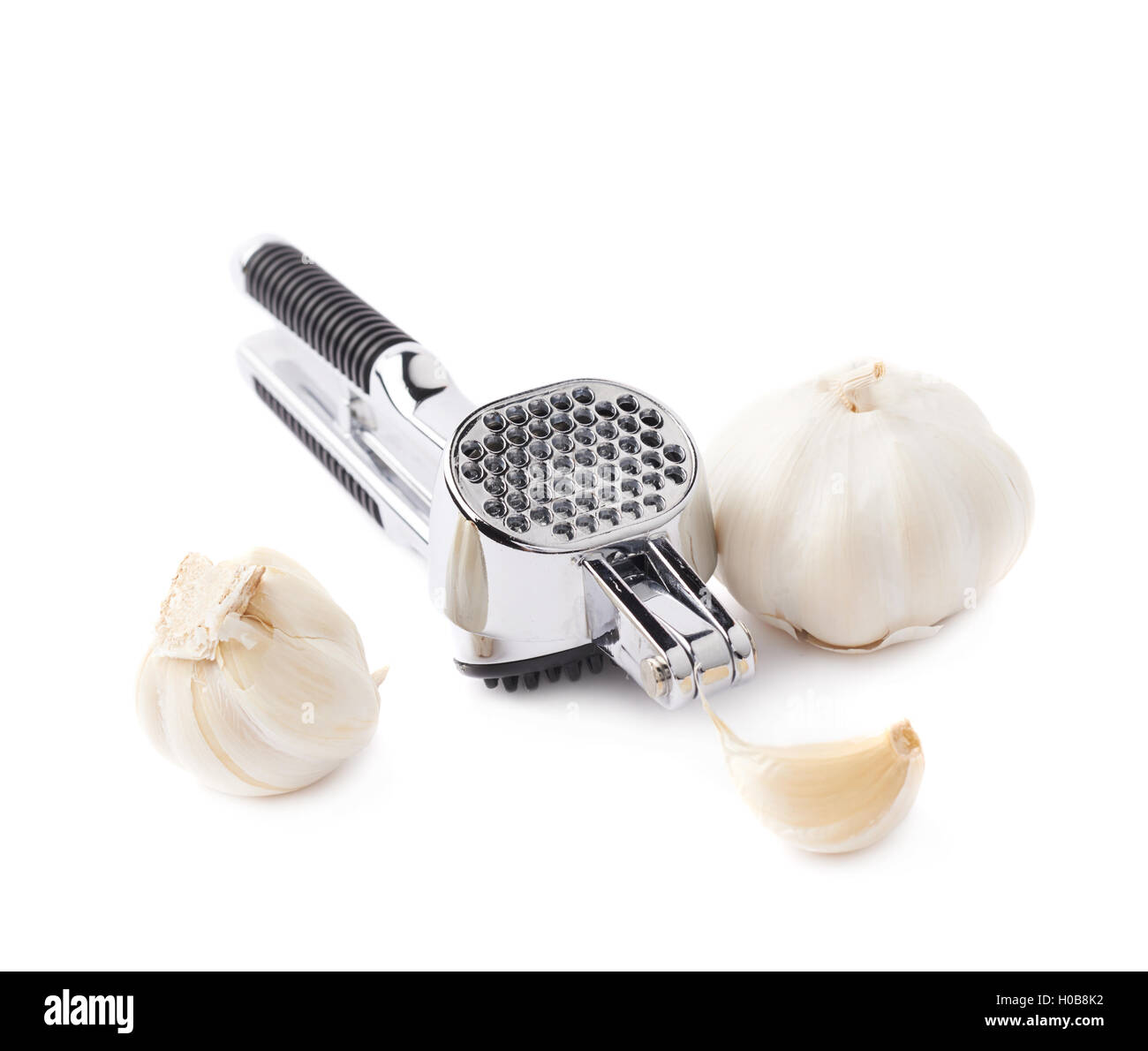 Metal garlic masher isolated over the white background Stock Photo Alamy