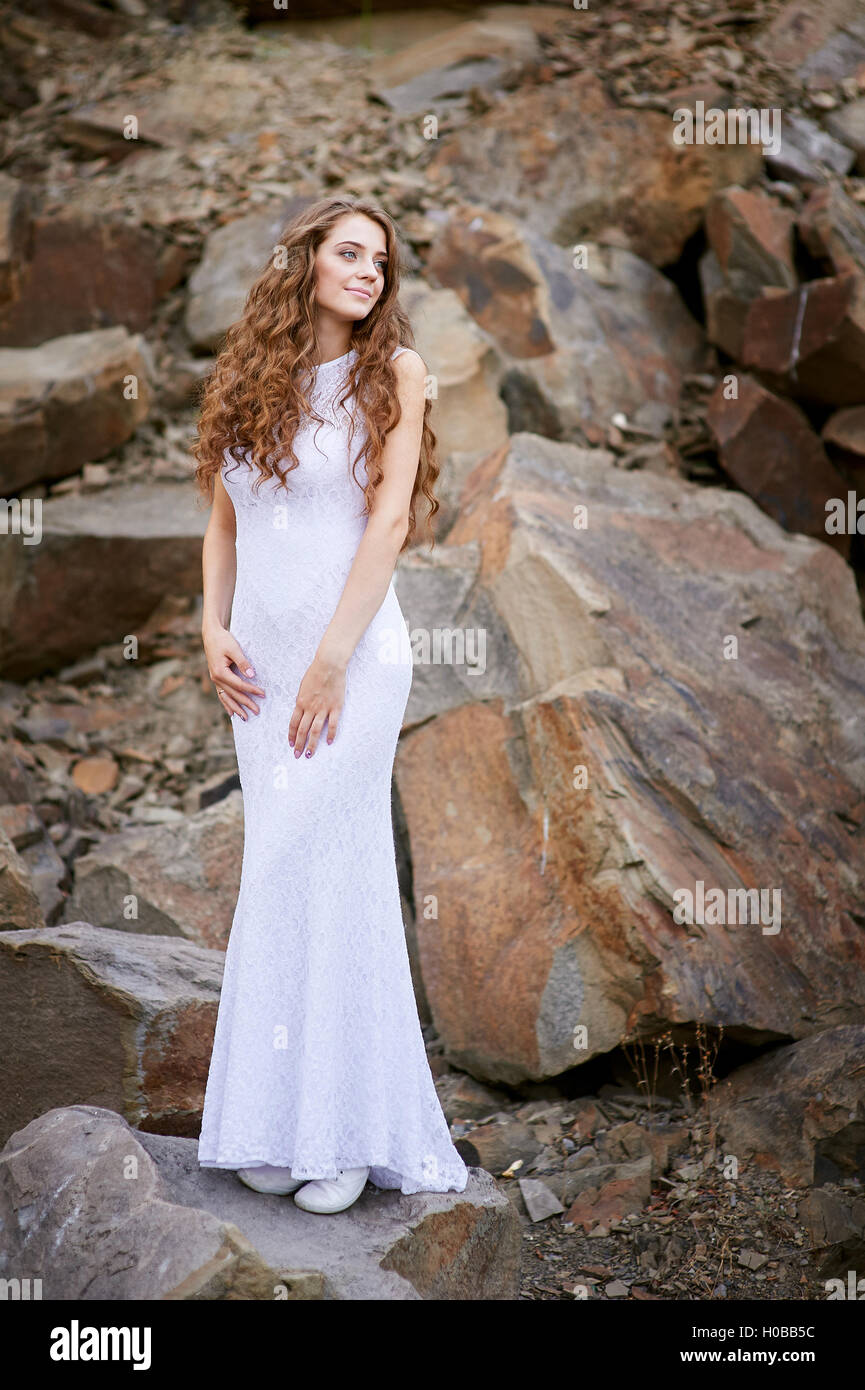 portrait beautiful young bride on background of stones Stock Photo