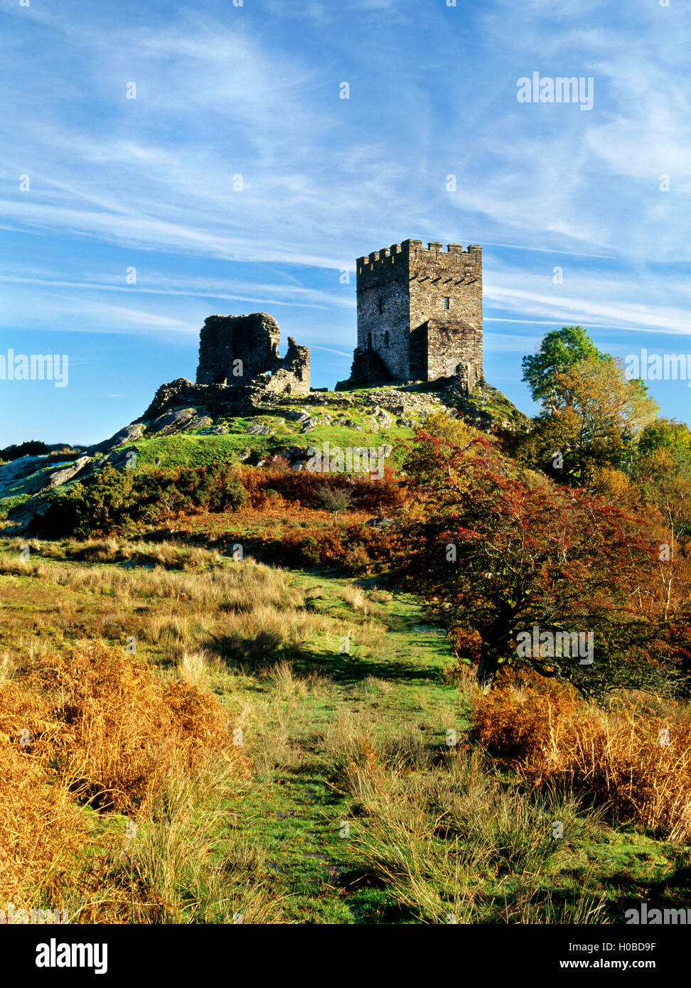 Dolwyddelan castle on its rocky knoll, seen from the ancient trackway which runs past its west side. North Wales, UK Stock Photo