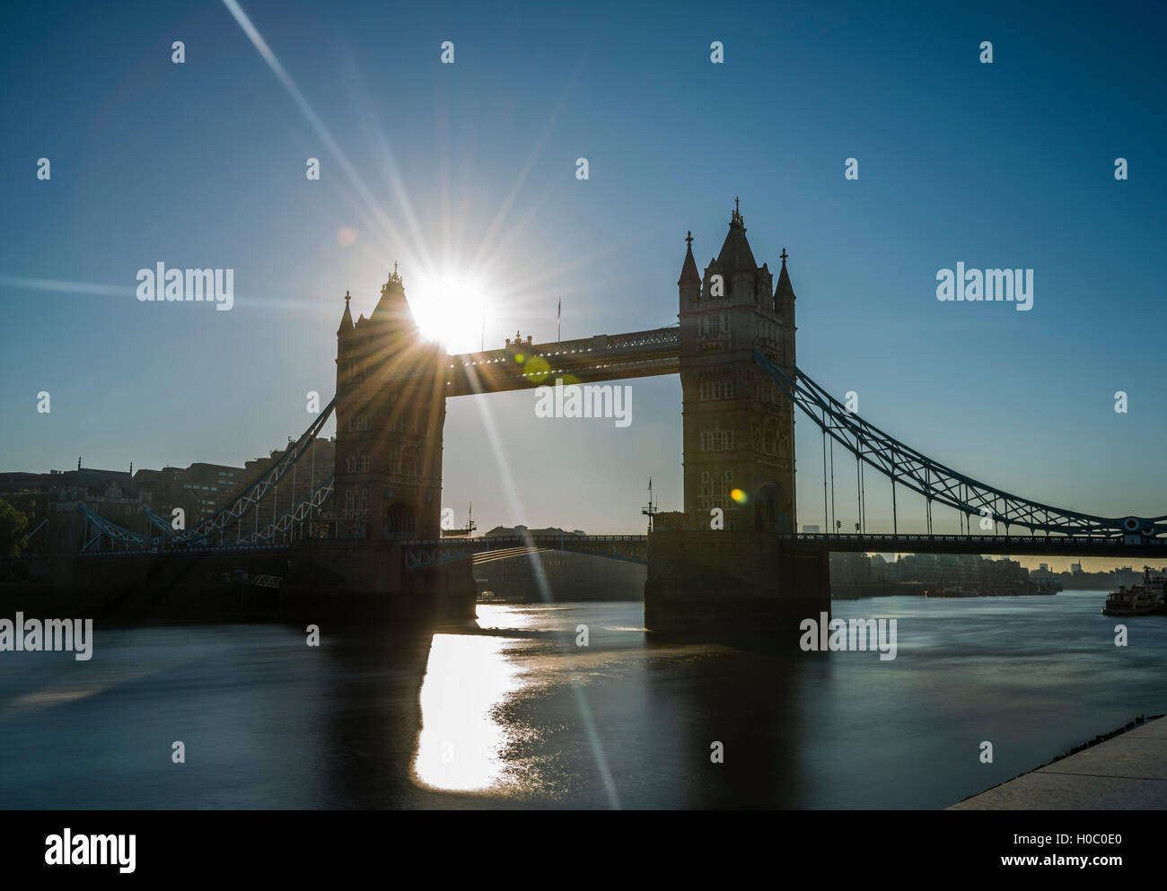 The rising sun captured in a long exposure next to Tower Bridge, London ...