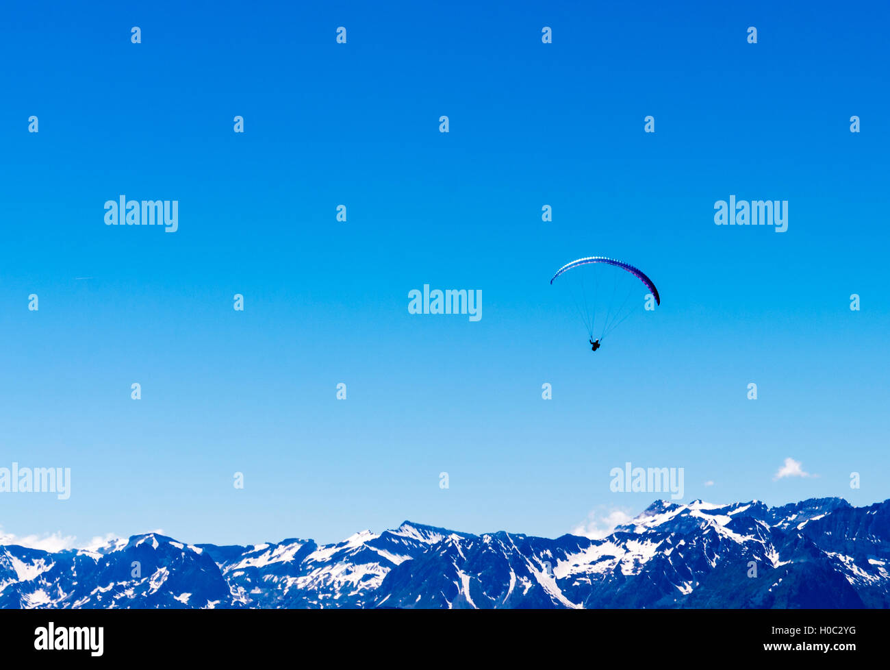 Single paraglider in the Swiss alps at Verbier. Stock Photo