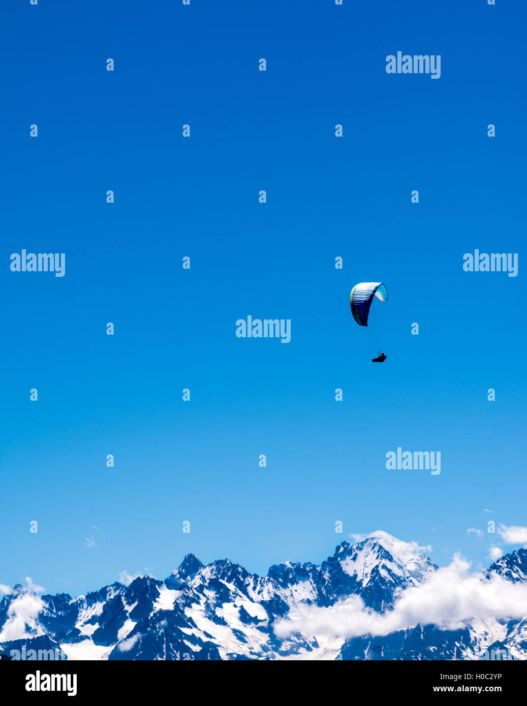 Single paraglider in the Swiss alps at Verbier. Stock Photo