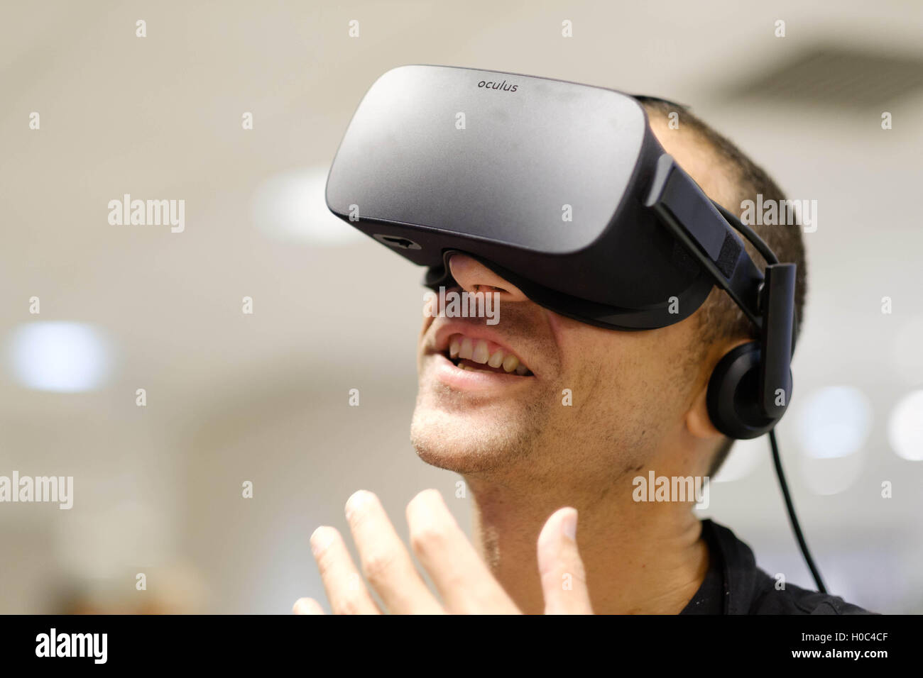 EDITORIAL USE ONLY Joel Davis tries out the Oculus Rift, the Facebook-owned  virtual reality headset which is released today in the UK, at a John Lewis  store in central London Stock Photo -
