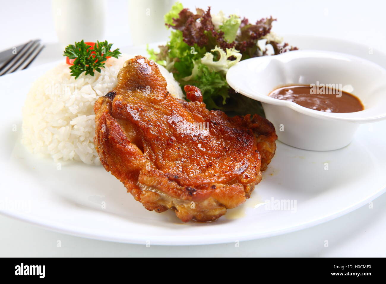 Vietnamese ribs broken rice or com tam suon on white plate Stock Photo