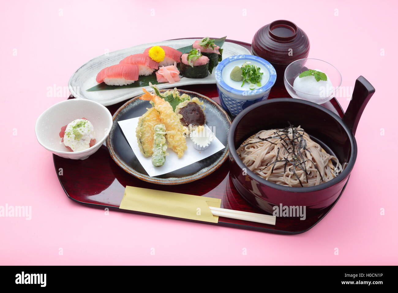 Tray meal of Japanese style with rice, sushi and soy sauces Stock Photo