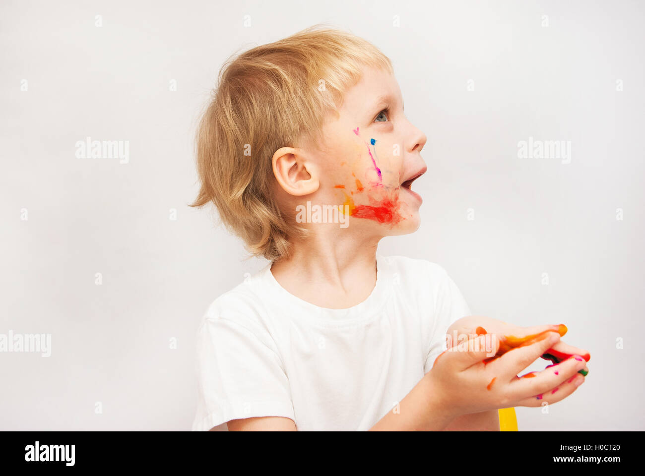 little boy hands painted in colorful paints Stock Photo