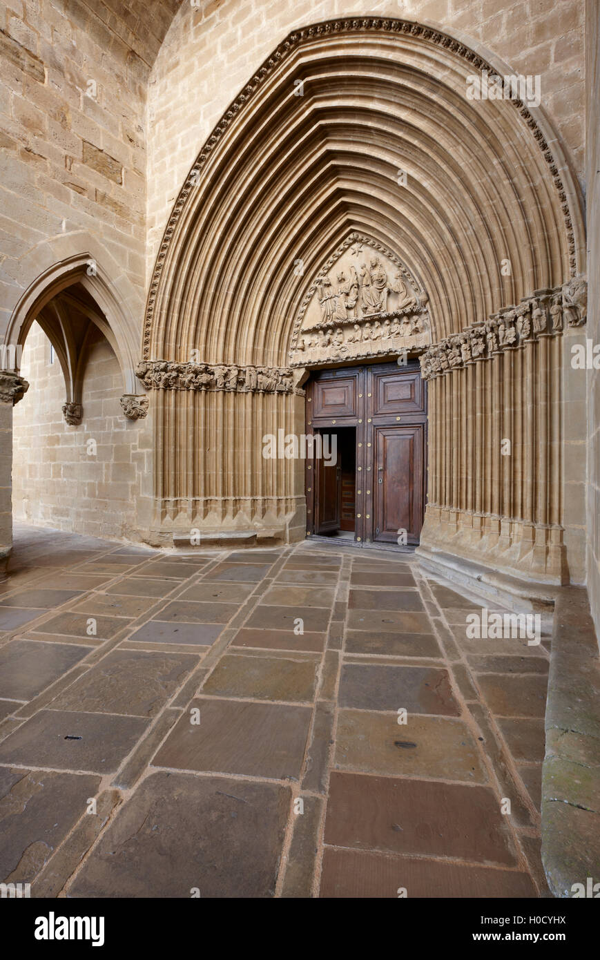 Romanesque portal of Santa Maria de Ujue sanctuary. Navarra, Spain. Vertical Stock Photo