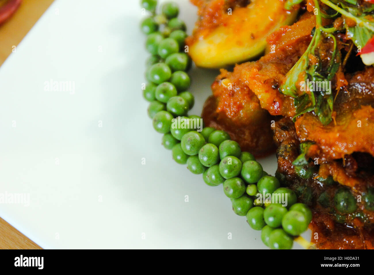 thai curry and garnish on the table. thai food. Stock Photo