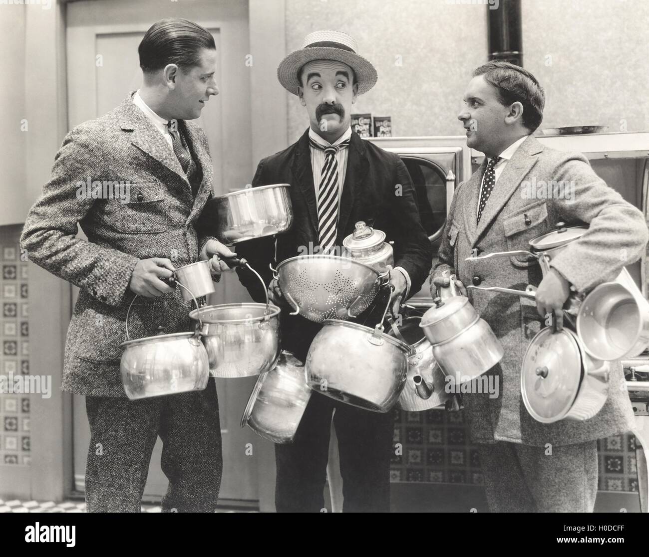 Men with lots of pots Stock Photo