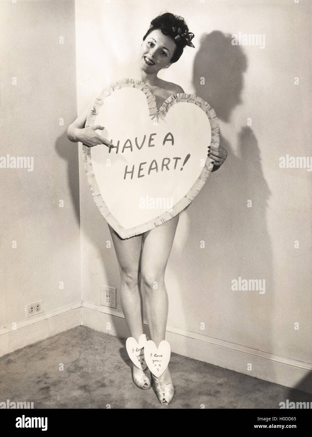 Naked woman covered by a heart-shaped sign Stock Photo - Alamy