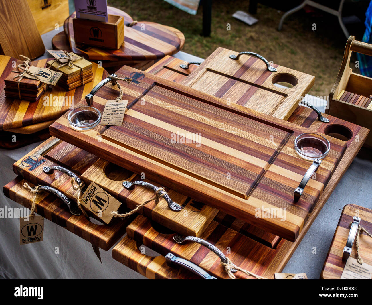 Handmade wooden items on sale at a market stall Stock Photo