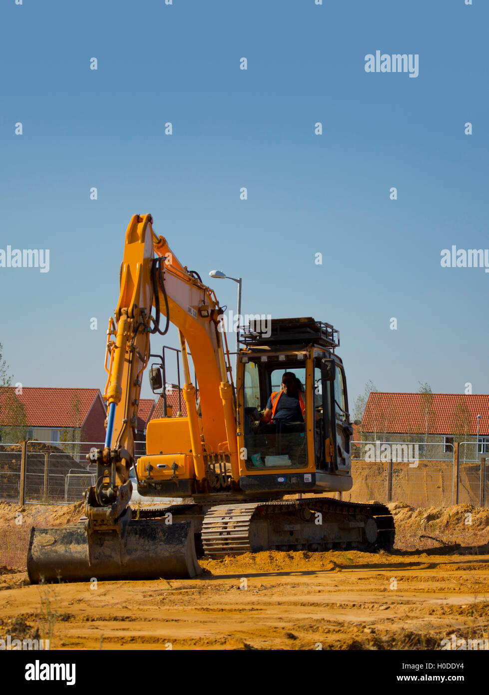 Digger or earth mover or backhoe working on a construction or building