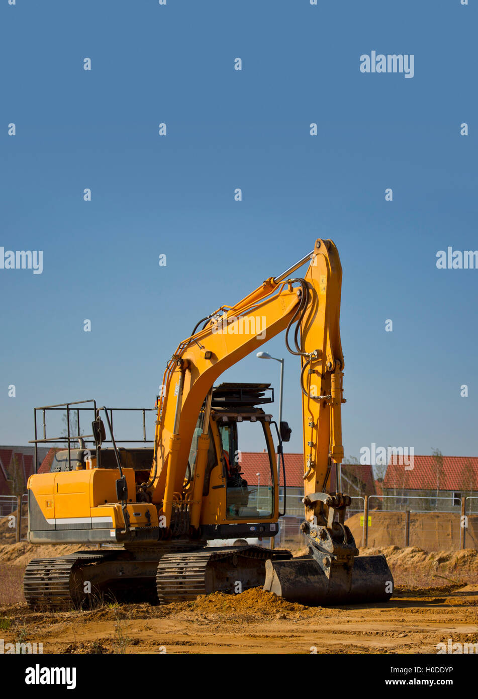 A digger or earth mover or backhoe on a construction site or building site Stock Photo