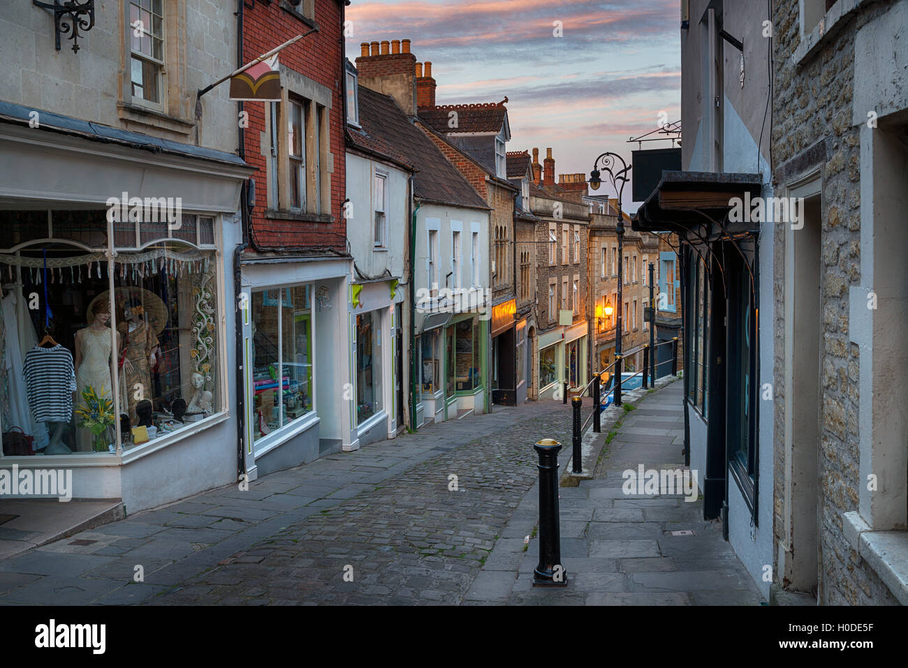 Dusk on Catherine Hill a cobbled street of historic buildings at Frome in Somerset Stock Photo