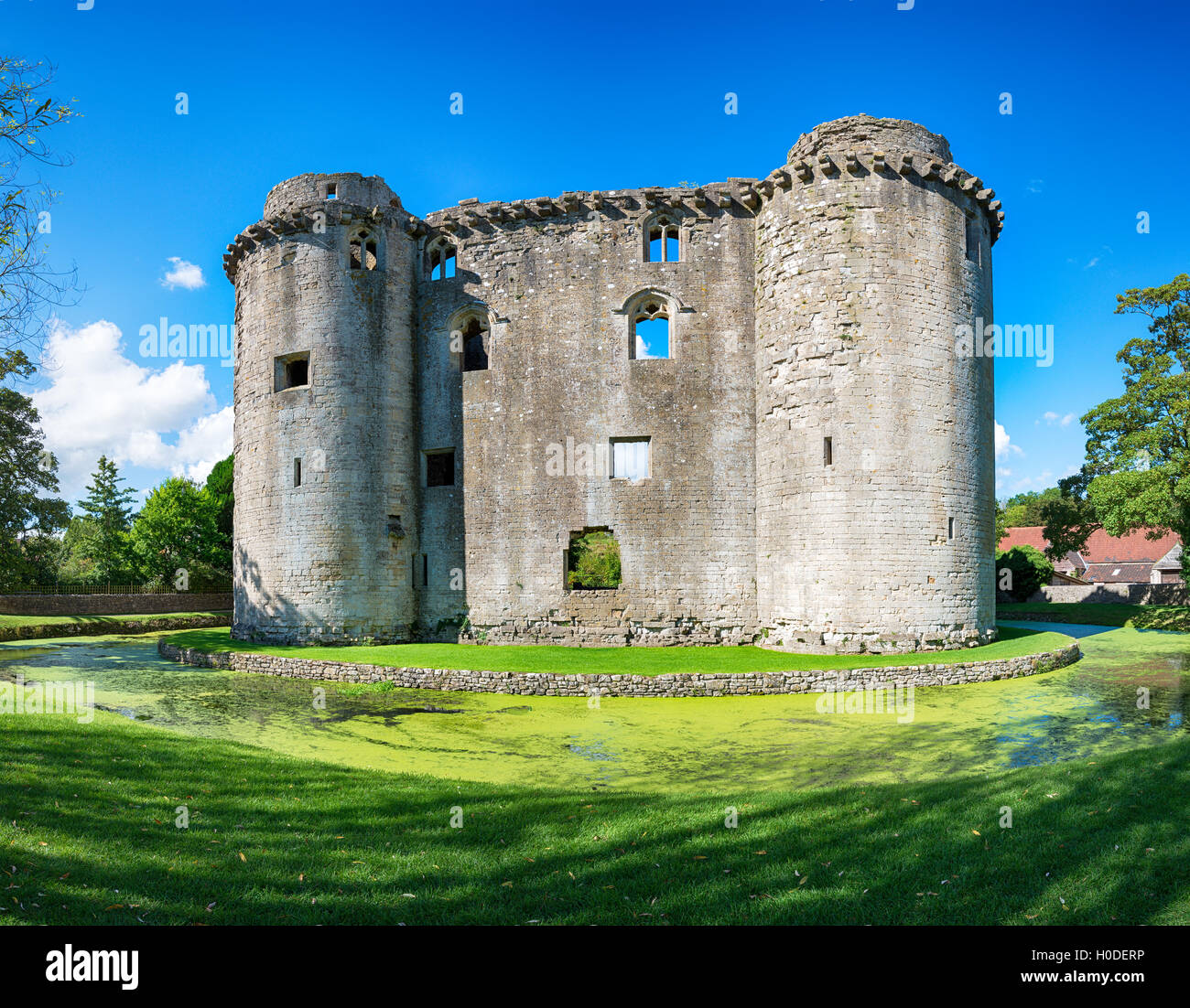 The moated medieval castle at the village of Nunney in Somerset Stock Photo