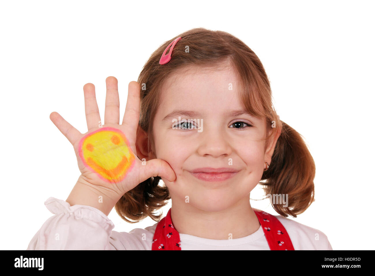 happy little girl with smiley on hand portrait Stock Photo