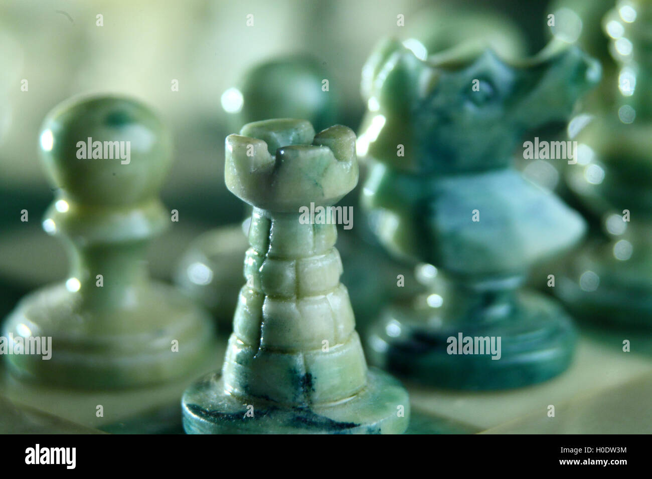 chessboard and alabaster chess on a black background Stock Photo - Alamy