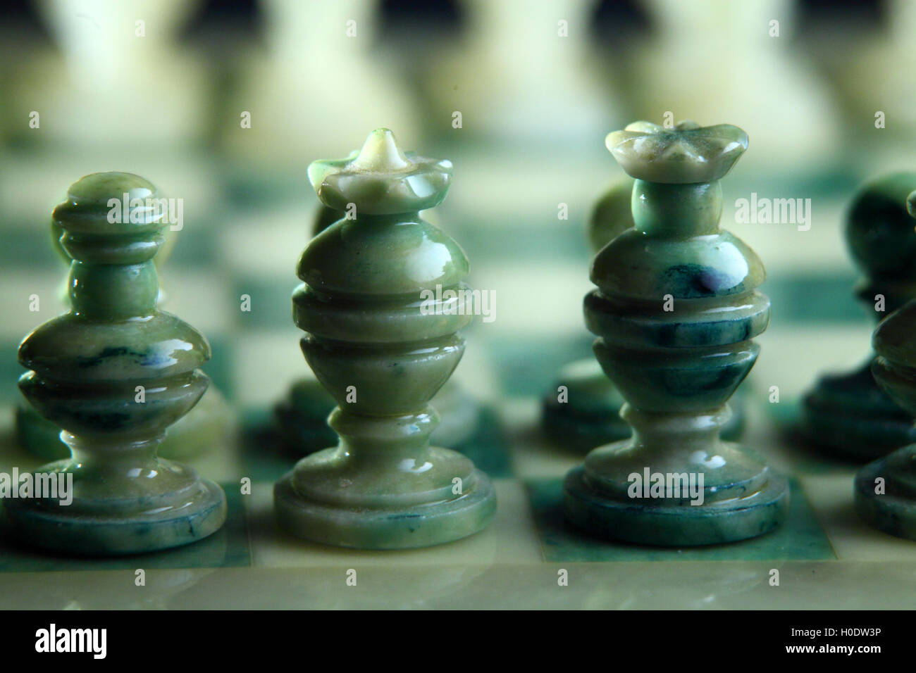 chessboard and alabaster chess on a black background Stock Photo - Alamy